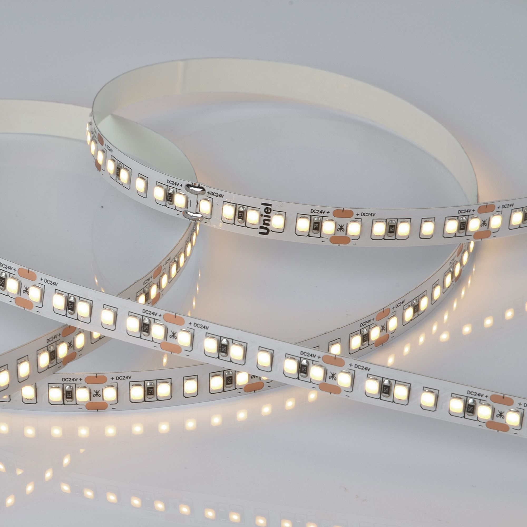 Лента гибкая светодиодная на самоклеящейся основе. ULS-2835-168LED/m-10мм-IP20-DC24V-14W/m-5м-3000K Катушка 5 м. в герметичной упаковке. (3000K)