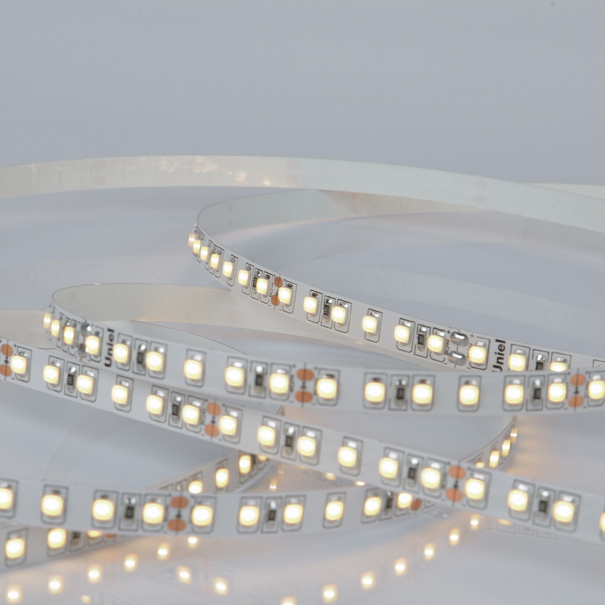 Лента гибкая светодиодная на самоклеящейся основе. ULS-2835-120LED/m-8мм-IP20-DC24V-9,6W/m-5м-3000K Катушка 5 м. в герметичной упаковке. (3000K)