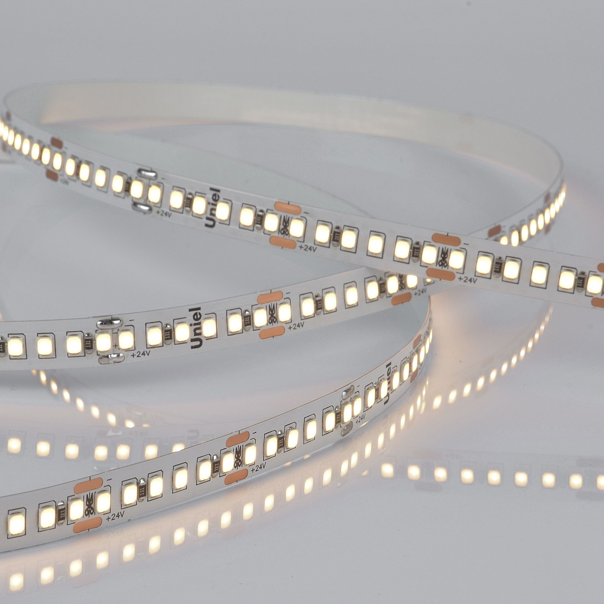 Лента светодиодная гибкая на самоклеящейся основе. ULS-2835-180LED/m-10mm-IP20-DC24V-17W/m-5M-3000K Катушка 5м. в герметичной упаковке. Теплый белый свет(3000К)